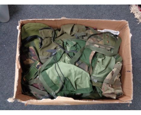 A box of army surplus clothing, webbing etc 