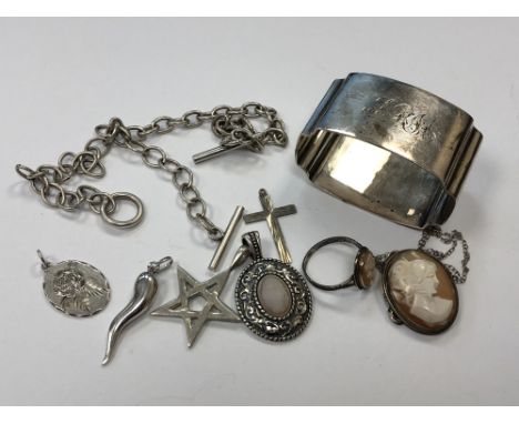 A silver napkin ring, cameo brooch and ring, five pendants and two chains 