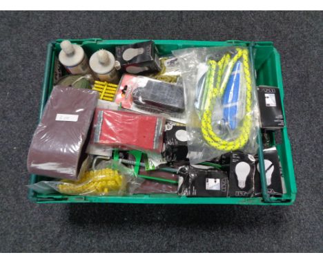 A crate of tools, bungee cord, socket adapter, palm sander, light bulbs etc 