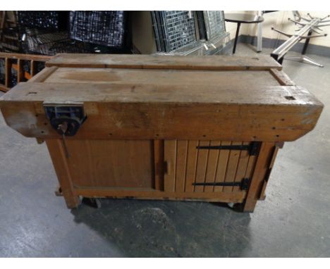 A 20th century wooden work bench fitted with a Record vice   CONDITION REPORT: Approximately 153cm long by 76cm deep by 83cm 