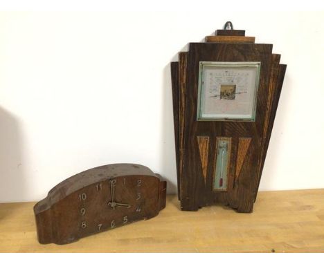 An Art Deco oak barometer (46cm x 26cm) and an Art Deco mantel clock wired for electricity (2)