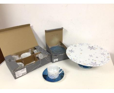 A Rosenthal set of six coffee cups and saucers and a cakestand (h.11cm x 32cm), all with Winter motif and in original packagi