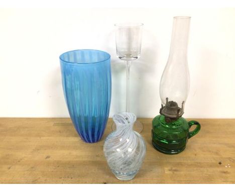 An oil lamp with green glass base with handle to side, with shade (38cm), a blue glass vase, a cased glass vase of urn form a