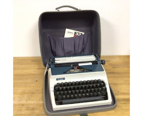 An Erika model 32 42 typewriter, with original travelling case and instructions (18cm x 39cm x 36cm)
