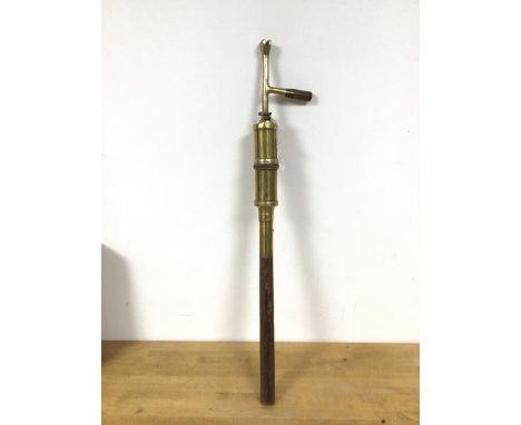 A 19thc brass street lamp lighter torch, marked G12 (73cm)
