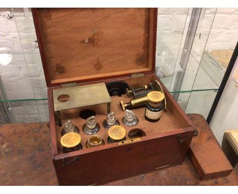 An Edwardian mahogany scientific equipment box, complete with a collection of bottles and tools including bottles stamped W J