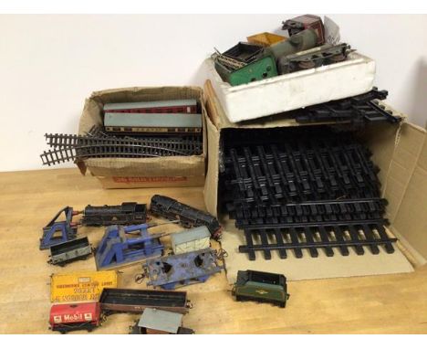 Train interest:  a quantity of track and diecast trains and carriages, most stamped Hornby