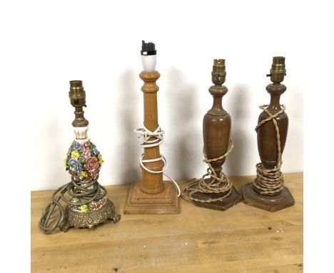 A 1950s/60s table lamp with ceramic floral body and gilt metal lamp holder and base (30cm) and three other wooden lamps (4)