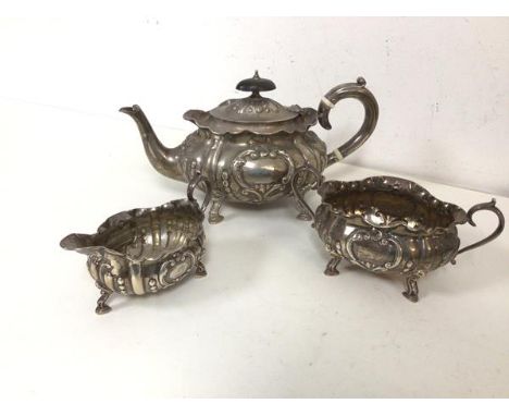 An 1899 London silver teapot with creamer and sugar bowl (770g)