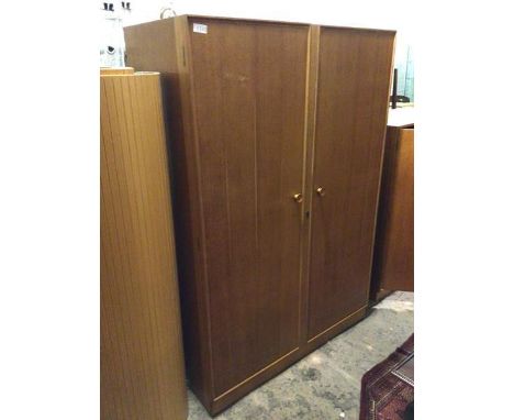 A mid century Meredew wardrobe, fitted two doors, one mirrored, with hanging rail and raised shelf to interior, on plinth bas