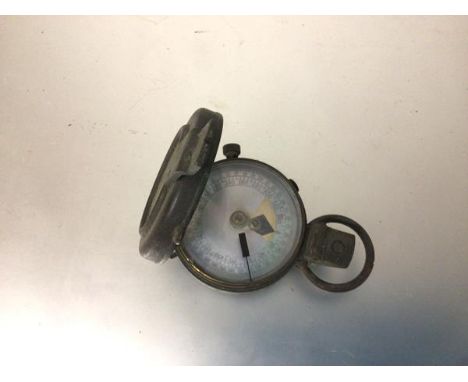 An Army brass compass, with inset glass top and mother of pearl dial, by Short ...., London (a/f) (d.5cm)