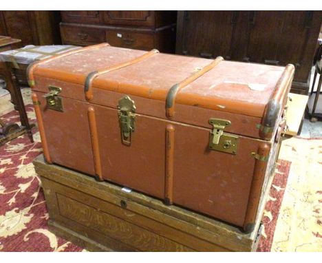 A vintage travelling trunk with a terracotta painted exterior, the interior with fitted tray (47cm x 92cm x 55cm)