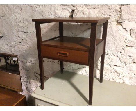 A mid century teak lamp table, the rectangular top above a lower tier fitted single drawer, on straight tapering supports (56