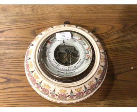 An Edwardian aneriod wall barometer, retailed by M. Edwards, Glasgow, with enamelled dial with ceramic Arts &amp; Crafts surr