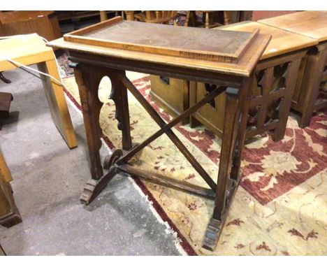 An oak lectern/desk, first half of the 20thc., with a three quarter raised gallery, with a carved foliate designed frieze, fi