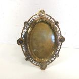 A late 19thc enamelled gilt and silvered brass photograph frame, oval, probably French, with pierced