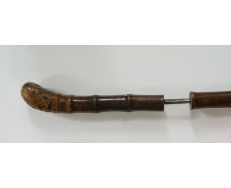 A late 19th / early 20th Century sword stick with rootball handle, the bamboo shaft hiding a tapering squared blade, no ferru