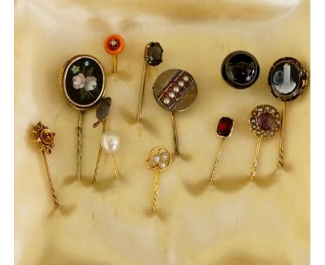 Twelve gem set and other stick pins including oval pietra dura panel, oval cameo panel of a pillar and flower, amethyst flank