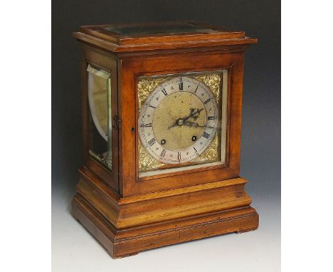 A Victorian walnut cased mantel clock in George II style the top with bevelled glazed panel, the front with bevelled glazed d