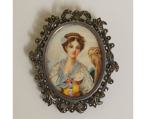 An oval half length portrait miniature of a young girl standing before a pillar, watercolour on ivory, pierced marcasite set 