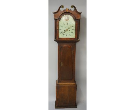 A George III mahogany and oak cottage longcase clock with swan neck pediment terminating in embossed brass roundels the arche