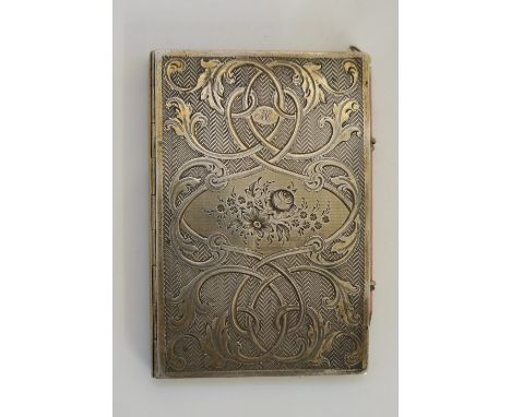 A mid Victorian silver cased notebook, hinged,  the front and back floral engraved with floral filled cartouche to the centre