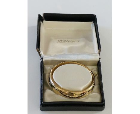 An Excalibur gold plated foliate engraved bangle in Victorian style, boxed