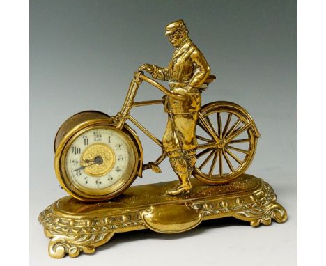 A late 19th Century novelty clock manufactured by The British United Clock Company Ltd, modelled as a gentleman and bicycle t