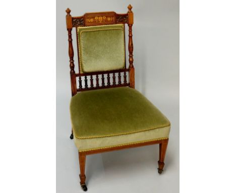 A Victorian solid rosewood salon chair the cresting rail with rectangular tablet inlaid with floral spray and scrolls flanked