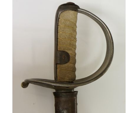 An 1855 German heavy cavalry sword with pierced basket, wire bound suede grip, steel scabbard, the blade inscribed C. Jurman.