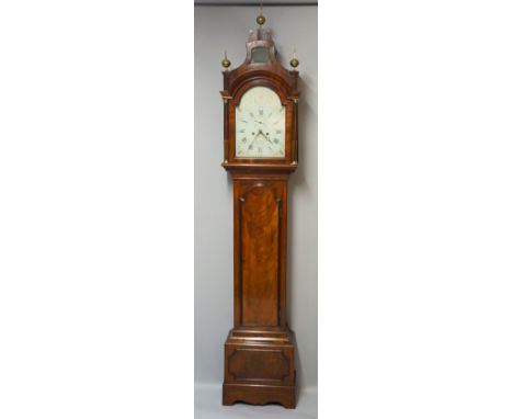 A George III mahogany longcase clock the hood with swept top, fret cut with ball and spire finials and glazed panel under, th