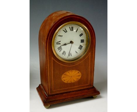 An Edwardian inlaid mahogany arch topped clock with cream dial, painted Roman numerals, brass bezzle, the line inlaid case ce