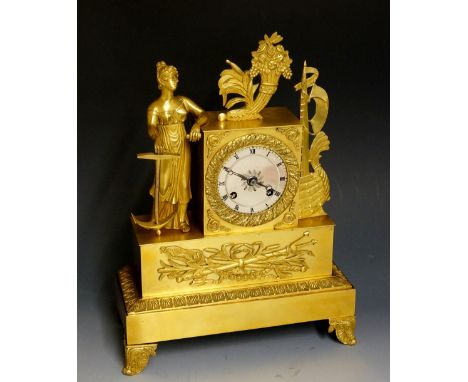 A mid 19th Century ormolu clock the silvered dial with Roman numerals contained within an acorn and leafy bezel, rectangular 