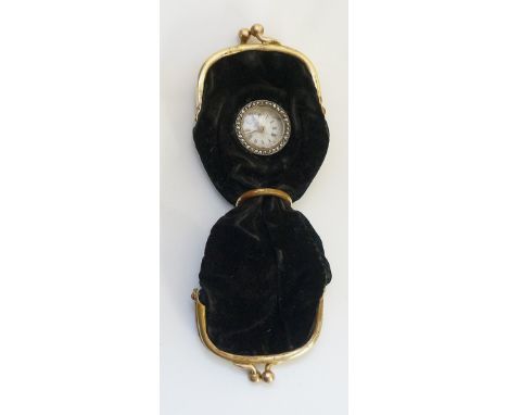 A late Victorian gilt metal mounted black velvet double sovereign purse, one side set with a keyless lever watch with white e