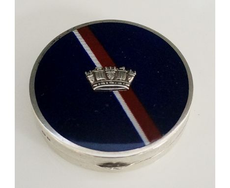 A George V silver and enamel rouge box the circular hinged lid enamelled in blue with red and white stripe centred on a styli