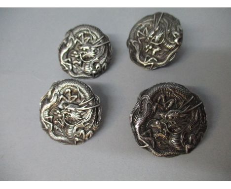 Four early 20th century Chinese silver buttons, each embossed with a dragon, stamped with character marks and 950, 1 1/4"dia 