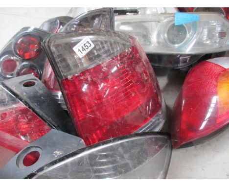 A huge lot of Ford/Vauxhall etc., front headlamp and rear lamp assemblies.