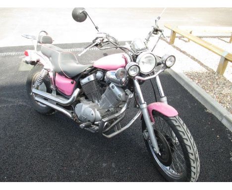 A Yamaha Virago V twin in metallic pink. First registered July 1988, currently on sorn. REG E891WUM