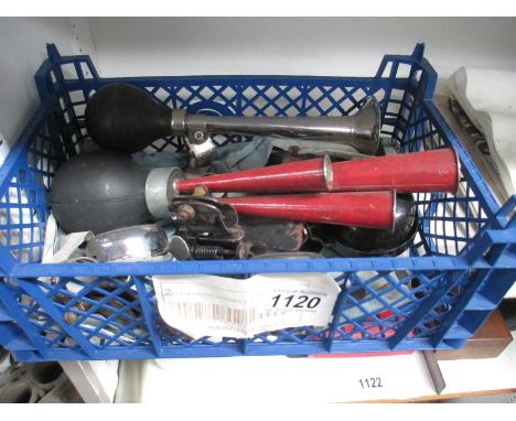 A quantity of vintage advertising bicycle bells, horns and tennis racket mounting bracket