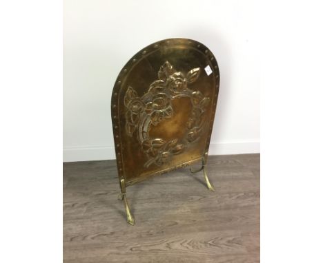 EMBOSSED BRASS FIRESCREEN WITH ARCHED TOP, 47cm wide