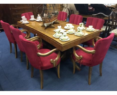 ART DECO FLAME MAHOGANY DINING TABLE, on twin pillar and tripod supports, 183cm x 99cm, along with eight armchairs and a serp