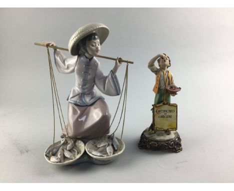 LLADRO FIGURE OF A WOMAN CARRYING FISH, 26cm high, along with an Italian figure of a boy eating fruit (2)