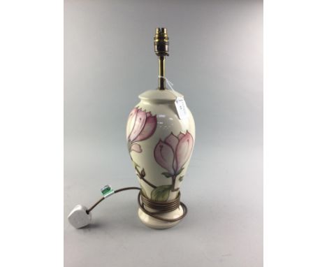 MOORCROFT TABLE LAMP, decorated with tube-lined stylised floral designs on a cream ground, 45cm high overall