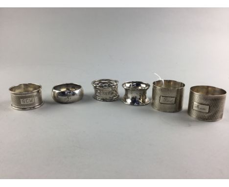 PAIR OF EARLY 20TH CENTURY SILVER ENGINE TURNED NAPKIN RINGS, along with four other napkin rings (6)