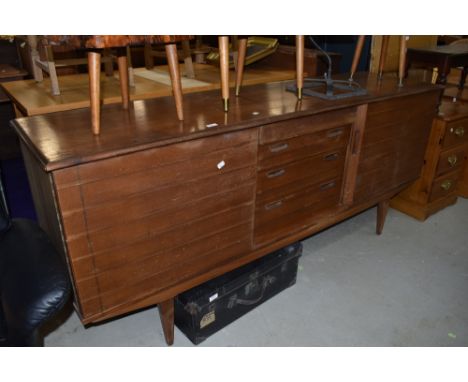 A vintage teak sideboard,could do with a tidy up