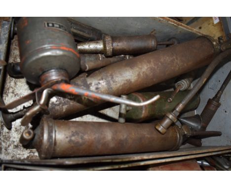 A selection of vintage oilers and grease guns