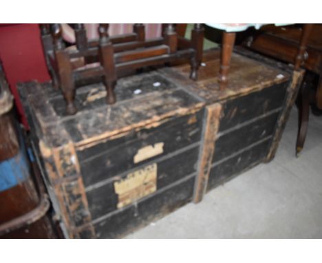 A vintage travel trunk or bedding box having distressed paint work with badges for blue star etc W50 H55 L113cm