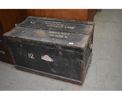 A vintage shipping trunk, worn labels