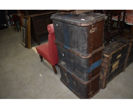 A vintage hard bodied travel trunk with wooden ribs