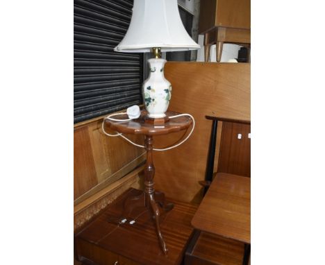 A reproduction wine table and a Masonware table lamp